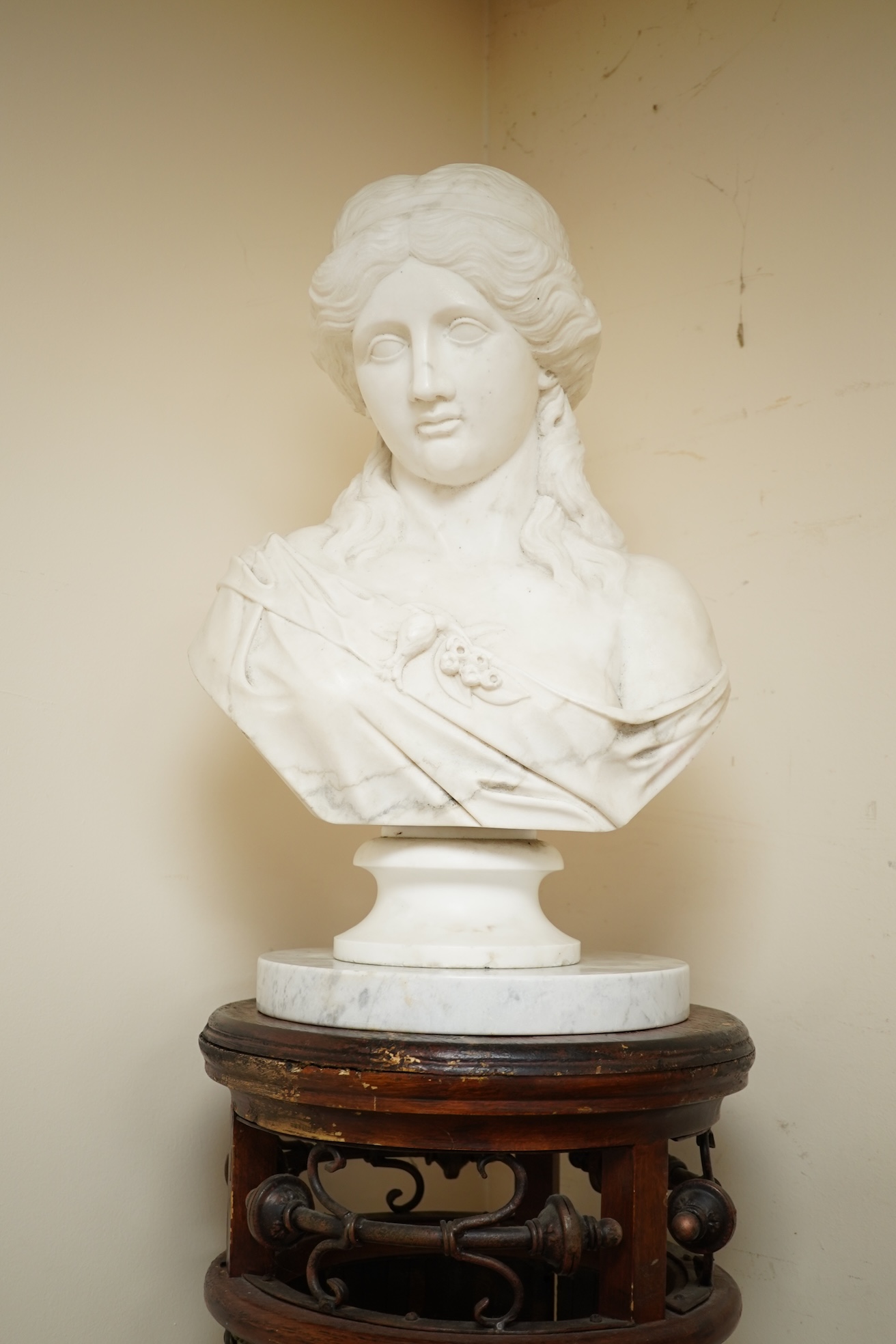 A Victorian style carved marble bust and later pedestal on ornate stand